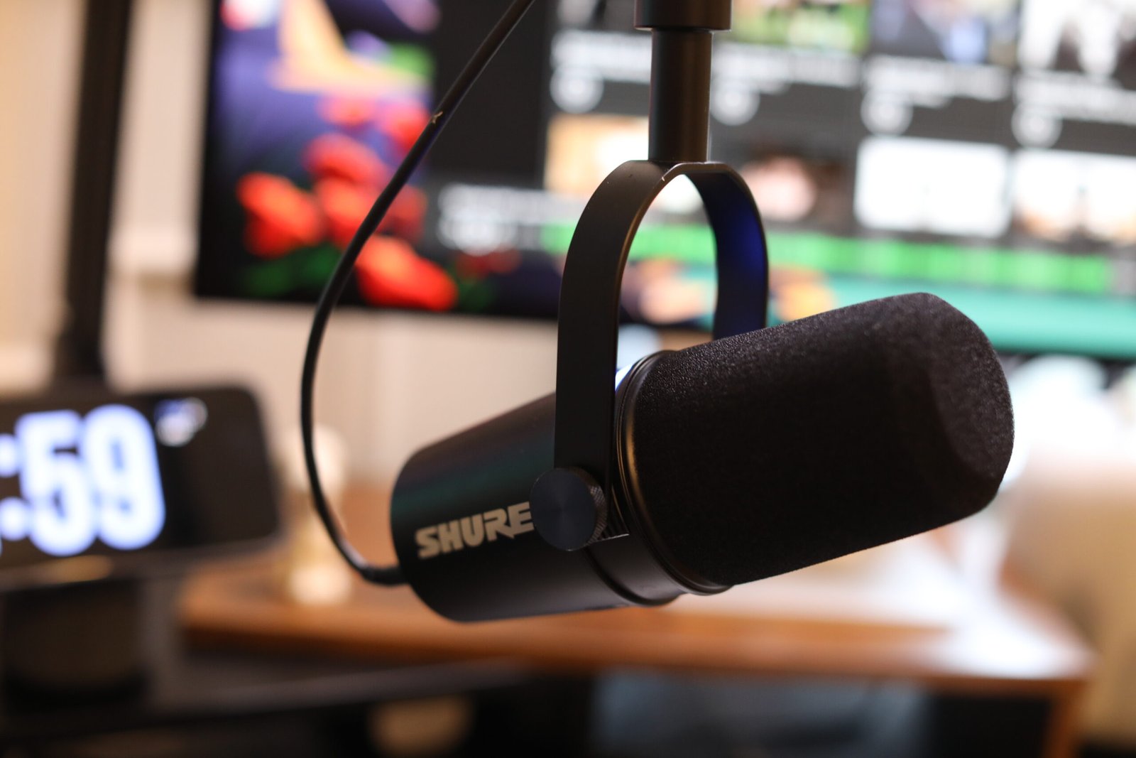 The Shure MV7+ microphone on a desk setup